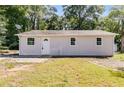 Newly renovated home with large windows and a grassy yard at 6085 Hotel St, Austell, GA 30106
