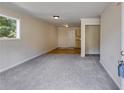 Spacious living room with gray carpet and access to kitchen at 6085 Hotel St, Austell, GA 30106
