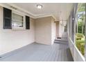 Screened porch with gray flooring and brick walls at 2354 Woodhill Ln, Atlanta, GA 30344
