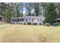 Front view of a ranch home with a spacious lawn at 2354 Woodhill Ln, Atlanta, GA 30344