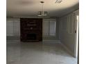 Spacious living room featuring a stone fireplace and marble-look tile floors at 996 Country Ct, Lawrenceville, GA 30044