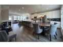 Open concept kitchen and living area with island and dining table at 3370 Reagan Way # 84, Lawrenceville, GA 30044