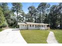 Newly renovated home with a charming front yard and walkway at 2656 County Line Sw Rd, Atlanta, GA 30331