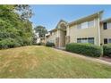 Tan two-story building with stone accents and landscaping at 1468 Briarwood Rd # 805, Brookhaven, GA 30319