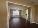 Dining room with dark hardwood floors and a view of the kitchen at 295 Rock House Rd, Lawrenceville, GA 30045