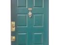 Dark teal front door with brass hardware and number 613 at 613 Wynnes Ridge Cir, Marietta, GA 30067