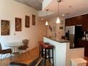 Modern kitchen with stainless steel appliances and hardwood floors at 44 Peachtree Ne Pl # 424, Atlanta, GA 30309