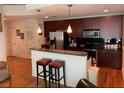 Modern kitchen with stainless steel appliances and hardwood floors at 44 Peachtree Ne Pl # 424, Atlanta, GA 30309