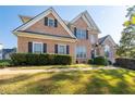Brick two-story house with a gray roof and landscaping at 2600 Wells Sw Ter, Atlanta, GA 30331