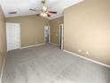 Spacious bedroom with carpeted floors and ceiling fan at 158 Ilex Dr, Canton, GA 30114