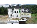 Aerial view of a white castle-style home at 1197 Dee Kennedy Rd, Auburn, GA 30011