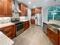 Modern kitchen with stainless steel appliances and granite countertops at 1512 Maplewood Ct, Woodstock, GA 30189