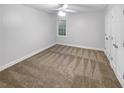 Spacious bedroom with neutral walls and carpeting at 1512 Maplewood Ct, Woodstock, GA 30189