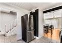 Modern kitchen with stainless steel refrigerator and tile floor at 5696 Kingsport Dr # 3, Atlanta, GA 30342