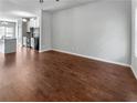 Open living room with hardwood floors and access to kitchen at 1861 Old Dogwood, Jonesboro, GA 30238