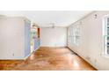 Simple dining room with hardwood floors and large windows at 3664 Broadview Ct, Decatur, GA 30032