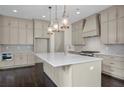 Modern kitchen features white quartz countertops, gray cabinets, and an island at 4085 Longleaf Ln, Tucker, GA 30084