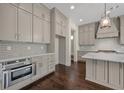 Modern kitchen with light gray cabinets and quartz countertops at 4085 Longleaf Ln, Tucker, GA 30084