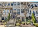 Stunning townhome exterior with brick, gray siding, and a purple door at 721 Bismark Ne Rd, Atlanta, GA 30324