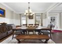 Formal dining room with a large table and chandelier at 523 Black Horse Cir, Canton, GA 30114