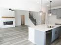 Modern kitchen with gray cabinets, quartz countertops, and stainless steel appliances at 3301 Pepperpike Ct, Loganville, GA 30052