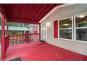 Red front porch with a view of the yard at 45 Harlan Lane Dr, Villa Rica, GA 30180