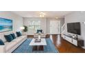 Spacious living room with hardwood floors and comfy furniture at 705 Chase Ln, Mcdonough, GA 30253