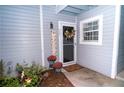Inviting condo entry with a welcoming sign and well-manicured plants at 2706 Suwanee Se Way # 12, Marietta, GA 30067