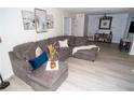 Spacious living room with L-shaped sectional sofa and light gray flooring at 2706 Suwanee Se Way # 12, Marietta, GA 30067