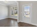 Bright entryway with hardwood floors and view to exterior at 6061 Spring Way, Stonecrest, GA 30038