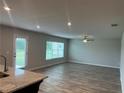 Large living room with hardwood floors and lots of natural light at 3290 Forest Green Dr, Douglasville, GA 30135