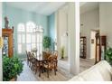 Formal dining room with a large table and hardwood floors at 500 Chestnut Walk, Canton, GA 30114
