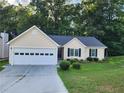 Ranch style house with a two-car garage at 835 Amelia Grove Ln, Lawrenceville, GA 30045