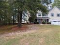 Two story house with a two car garage and manicured lawn at 1205 Bramlett Creek Pl, Lawrenceville, GA 30045