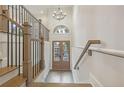 Two-story entryway with hardwood floors and a chandelier at 2131 Bellrick Rd, Atlanta, GA 30318