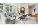 Spacious living room featuring a sectional sofa and large windows at 2500 Peachtree Nw Rd # 405S, Atlanta, GA 30305