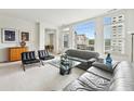Sun-drenched living room with ample natural light and city views at 2500 Peachtree Nw Rd # 405S, Atlanta, GA 30305