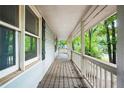 Long wooden porch overlooking a wooded backyard at 4101 Oak Stone Dr, Douglasville, GA 30135