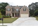 Two story brick home with a two car garage at 3853 Locksley Trl, Douglasville, GA 30135