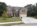 Two story brick home with a two car garage at 3853 Locksley Trl, Douglasville, GA 30135