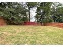 Spacious backyard with wooden privacy fence at 647 Stonebridge Loop, Lithonia, GA 30058