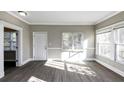 Sunlit living room with hardwood floors and ample natural light at 15 Johnson Nw Rd, Atlanta, GA 30318