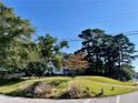 House nestled on a spacious lot with lush greenery at 3970 Norman Rd, Stone Mountain, GA 30083