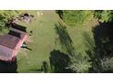 Aerial view showing house and large backyard with detached barn at 2681 Buford Hwy, Cumming, GA 30041