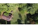Aerial view showing house and large backyard with detached barn at 2681 Buford Hwy, Cumming, GA 30041