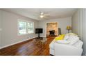 Bright living room with hardwood floors, neutral walls and a comfy sofa at 123 Arnold Pl, Jonesboro, GA 30236