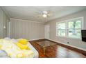 Living room with hardwood floors, neutral walls and a comfy sofa at 123 Arnold Pl, Jonesboro, GA 30236