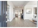 Inviting foyer with wood-look flooring and view into the living area at 6200 Misty Hill Ln, Buford, GA 30518