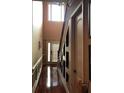 Bright hallway with hardwood floors and high ceilings at 1175 Grassy Oat Ln, Lawrenceville, GA 30045