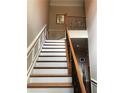 Elegant staircase with wood and wrought-iron details at 1175 Grassy Oat Ln, Lawrenceville, GA 30045